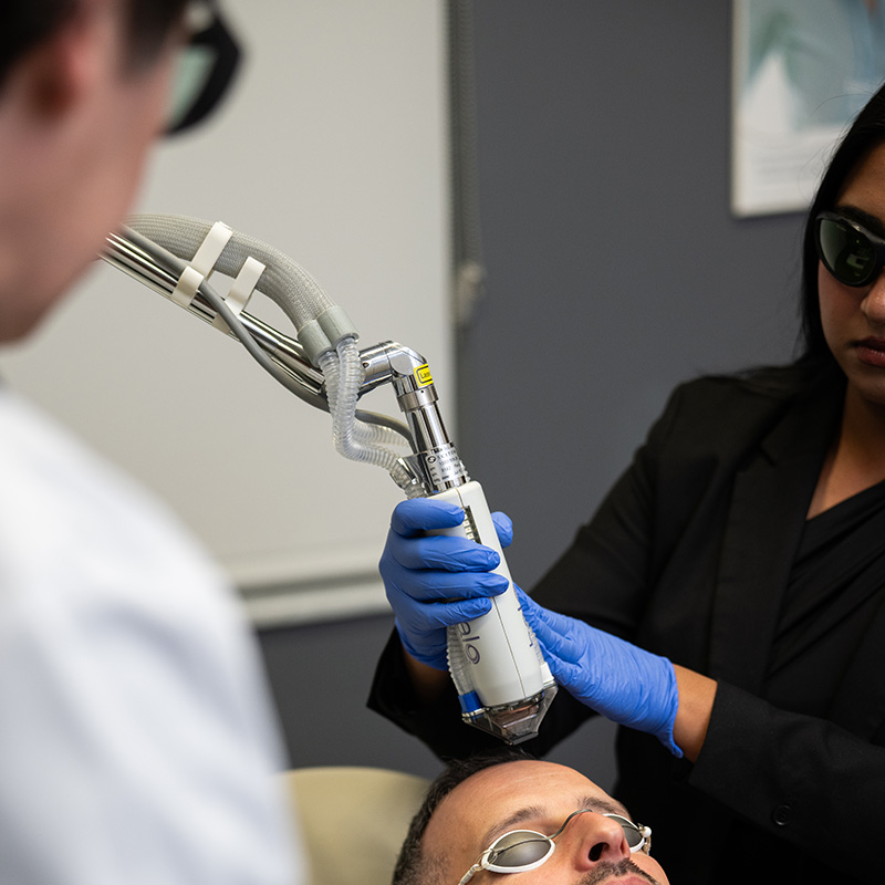 Dr. Radin and assistant performing laser